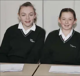  ??  ?? Gemmima Ngubeni, Erin Gardner and Caitlin Kelly looking after the electoral register in the Mock Election.