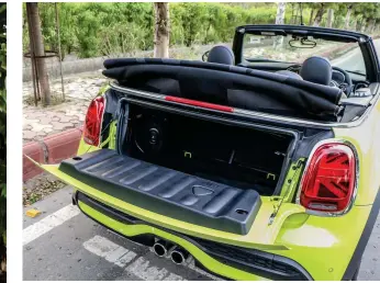  ??  ?? The roof mechanism is effortless and the hatch/seat for one is a pretty nice addition to
the Convertibl­e