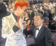  ?? Photo: Sandy Powell ?? Actor Leonardo DiCaprio signs the suit at the Oscars ceremony