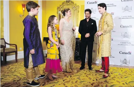  ?? — THE CANADIAN PRESS ?? Prime Minister Justin Trudeau, Sophie Gregoire Trudeau, and children Xavier, 10, and Ella-Grace, 9, met Indian movie star Shah Rukh Khan in Mumbai Tuesday during their visit to India.