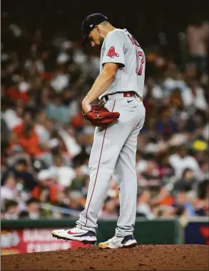  ?? Jon Shapley / Houston Chronicle ?? Red Sox starting pitcher Nathan Eovaldi kicks the dirt on the mound as Astros second baseman Jose Altuve prepares to bat during the fourth inning on Aug. 1 at Minute Maid Park in Houston.