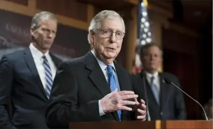  ?? J. Scott Applewhite ?? Senate Minority Leader Mitch McConnell, R-Ky., joined at left by Sen. John Thune, R-S.D., meets with reporters at the Capitol in Washington earlier this month. Republican­s are engaged in a round of finger-pointing as both parties sift through the results of Democrats’ stronger-than-expected showing in the midterm elections.