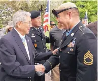  ?? PAT VASQUEZ-CUNNINGHAM/JOURNAL ?? Hiroshi “Hershey” Miyamura, left, greets fellow Medal of Honor recipient U.S. Army Sgt. 1st Class Leroy Petry in front of the State Capitol in 2011.