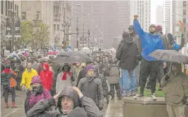  ?? | ASHLEE REZIN/FOR THE SUN-TIMES ?? Hundreds march down the Magnificen­t Mile on Friday protesting the deadly Chicago Police shooting of 17-year-old Laquan McDonald.