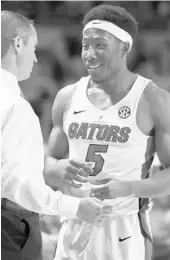  ?? RON IRBY/AP ?? Coach Mike White, guard KeVaughn Allen and the Gators fell into the consolatio­n bracket of the Battle 4 Atlantis.