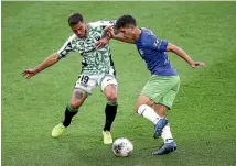  ?? GETTY IMAGES ?? Phoenix defender Liberato Cacace fights for possession with Western’s Josh Risdon.