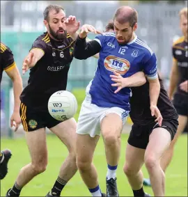  ?? ?? Donal Owens finds himself under attack from Brian Mullin and Jack Mccann.
