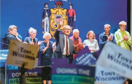  ?? ANDY MANIS/AP ?? Democratic Gov. Tony Evers waves on Wednesday in Madison, Wis., after beating Republican businessma­n Tim Michels in Tuesday’s election.