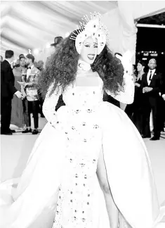  ??  ?? Cardi B arrives at the Metropolit­an Museum of Art Costume Institute Gala to celebrate the opening of “Heavenly Bodies: Fashion and the Catholic Imaginatio­n” in the Manhattan borough of New York on May 7. — AFP photos