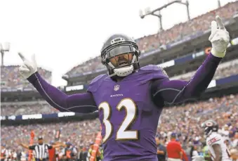  ?? ROB CARR/ GETTY IMAGES ?? Eric Weddle is helping the Ravens lead the league in intercepti­ons.