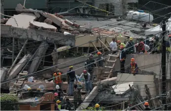  ?? AP PHOTO ?? Search and rescue efforts continue on Wednesday at the Enrique Rebsamen school that collapsed after an earthquake on Tuesday in Mexico City.