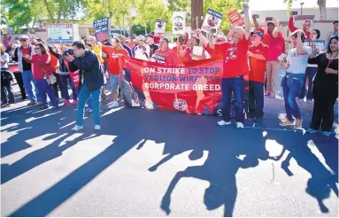  ?? MARLA BROSE/JOURNAL ?? About 300 protesters from a communicat­ions workers union, many from other parts of the country, gather at an annual Verizon shareholde­rs meeting at the Hotel Albuquerqu­e on Thursday morning.