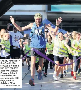  ?? ANDREW MATTHEWS ?? Charity fundraiser Ben Smith, 34, crosses the finish line with children from Portishead Primary School, completing 401 marathons in 401 days, back in October 2016