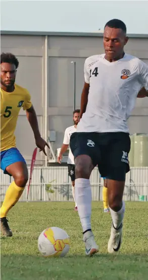  ?? Photo: Fiji FA Media ?? Digicel national football striker Sairusi Nalaubu controls the ball against Solomon Islands at Churchill Park, Lautoka, on March 26, 2023.