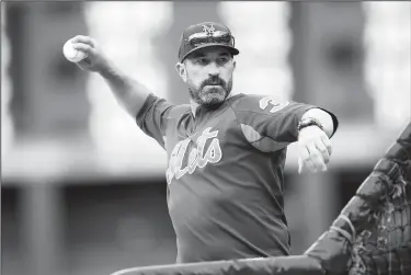  ?? AP/DAVID ZALUBOWSKI ?? Then-New York Mets manager Mickey Callaway throws in batting practice on Sept. 17 before the team’s game against the Colorado Rockies in Denver.