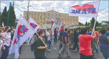  ??  ?? Supporters of the Greek communist party-affiliated Pame labor union march in front of the parliament in Athens.
