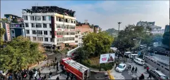  ?? PTI ?? Rescue efforts being carried out after a massive fire at a hotel at Karol Bagh area, in New Delhi