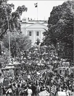  ?? SAMUEL CORUM/GETTY ?? Protesters stretch for blocks during demonstrat­ions Saturday near the White House.