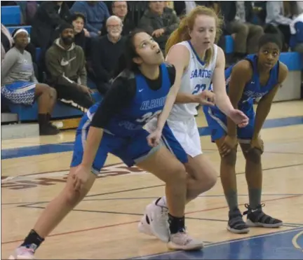  ?? STAN HUDY SHUDY@DIGITALFIR­STMEDIA.COM @STANHUDY ON TWITTER ?? Saratoaga Springs senior Caroline Lafountain is tripped up by Albany High’s Leah Gonzalez as she is blocked out under the basket during a free throw in the second quarter Thursday night.