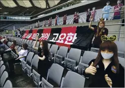  ?? RYU YOUNG-SUK — YONHAP VIA AP ?? The cheering mannequins used by FC Seoul to help add stadium atmosphere for their K-League game Sunday weren’t the dolls the soccer club thought they