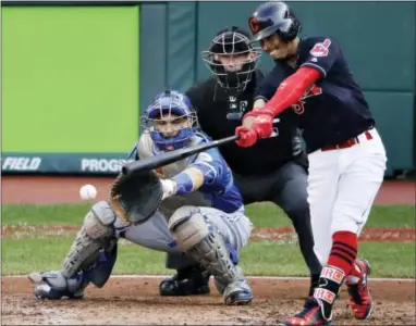 ?? CAHRLIE RIEDEL — THE ASSOCIATED PRESS ?? Cleveland Indians shortstop Francisco Lindor singles in a run in the third inning Saturday against the Toronto Blue Jays.