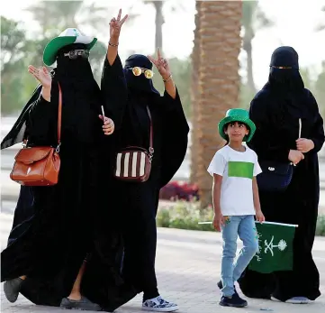  ??  ?? Saudi Arabian women arrive at a rally to celebrate the 87th annual National Day of Saudi Arabia in Riyadh. — Reuters photo