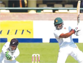  ?? — AFP ?? LEADING FROM THE FRONT . . . Hamilton Masakadza was on fire at Queens Sports Club yesterday as he scored a century on day one of the second Test against West Indies.