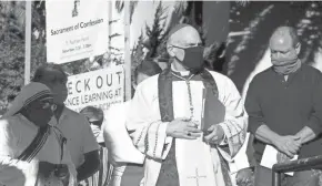  ?? AP FILE ?? Archbishop Salvatore Cordileone conducts an exorcism outside of St. Raphael Catholic Church in San Rafael, California.