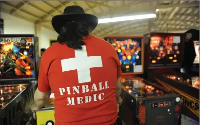  ?? NEWS-SENTINEL FILE PHOTOGRAPH ?? A pinball medic plays a game during the first day of the Golden State Pinball Festival at the Lodi Grape Festival grounds in Lodi on Friday, May 18, 2018. The event returns to Lodi this weekend.