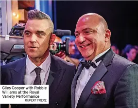  ?? RUPERT FRERE ?? Giles Cooper with Robbie Williams at the Royal Variety Performanc­e