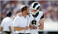  ?? AP PHOTO BY JAE C. HONG ?? Los Angeles Rams head coach Sean Mcvay, left, talks with Johnny Hekker during the second half of an NFL football game against the Indianapol­is Colts, Sunday, in Los Angeles.