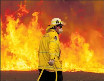  ?? PICTURE / AP ?? Ross Forbes of Kerikeri points out that the 2008 Australian Ross Garnaut climate change report stated that projection­s of fire weather “suggest that fire seasons will start earlier, end slightly later, and generally be more intense” and that the effect “increases over time, but should be directly observable by 2020.”