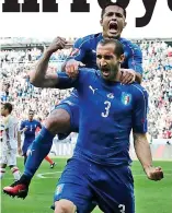  ??  ?? Goal! Italy’s Giorgio Chiellini’s joy at Euro 2016 with team-mate Eder