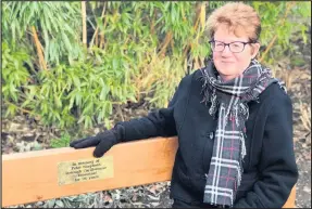  ??  ?? Enid Shepherd, pictured on the bench in Queen’s Park, Loughborou­gh, which has been installed in memory of her husband Peter, Borough Carillonne­ur Emeritus, who died in 2016.