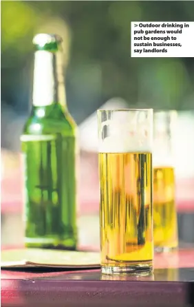  ??  ?? > Outdoor drinking in pub gardens would not be enough to sustain businesses, say landlords