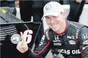  ?? GABRIELLA ANGOTTI-JONES THE ASSOCIATED PRESS ?? Robert Wickens from Toronto poses for photos next to his pole-position sticker on his car after taking the pole in qualifying Saturday for the IndyCar auto race.