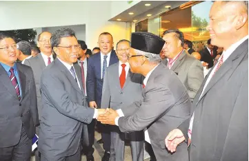  ??  ?? Shafie (third left) greeting the delegates at the 23rd Sabah State District Officers Conference yesterday. Also seen are Tangau (second left) and Ewon (left).