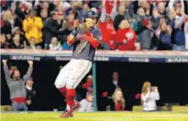  ?? TIM BRADBURY/GETTY IMAGES ?? Indians SS Francisco Lindor celebrates after scoring the first run during Game 1 of the World Series Tuesday in Cleveland. The former Montverde Academy standout had 3 hits.