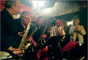  ?? AP PHOTO/RUSSELL CONTRERAS ?? In this June 18 photo, dancers swing to jazz at Caveau de la Huchette, a Paris jazz club shown in the 2016 movie "La La Land" and was a popular spot for African American musicians in 1950s. Travelers to Paris can create a different type of itinerary...