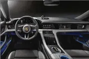  ?? PORSCHE ?? The interior of the Taycan also signals the start of a new era of design at Porsche, officials said. The free-standing, curved instrument cluster forms the highest point on the dashboard. This places a clear focus on the driver.