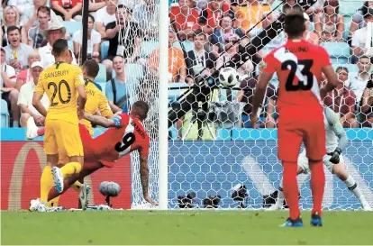  ??  ?? Above: Striker Paolo Guerrero (third left) scores Peru’s second goal against Australia during their World Cup Group C match at the Fisht Stadium in Sochi, Russia, yesterday. Peru won
2-0 but went out along with Australia. Left: Denmark’s Mathias...