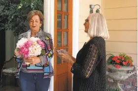  ??  ?? Richardson delivers a flower arrangemen­t in Atherton that was ordered by Cachi Kenna. Richardson is looking forward to becoming an employee of Deliv.