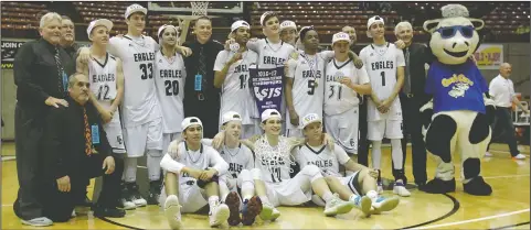  ?? DAVID WITTE/NEWS-SENTINEL ?? Elliot Christian players and coaches celebrate follwing Elliot's victory over Argonaut in the Sac-Joaquin Section Division V Championsh­ip on Saturday at University of the Pacific in Stockton. The Eagles took down Argonaut 83-53.