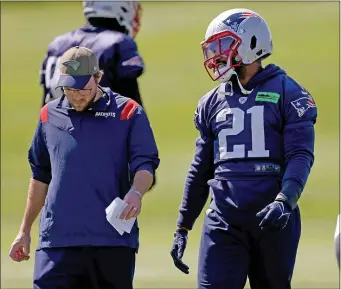  ?? MATT STONE — BOSTON HERALD ?? Adrian Phillips, right, walks with safety coach Brian Belichick during practice at Gillette Stadium on Sept. 15, 2022.