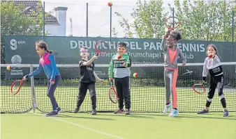  ?? ?? Potential stars of the future in action at a tennis camp.