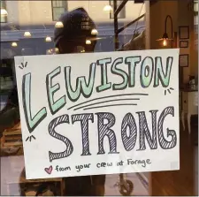  ?? AP PHOTO/JAKE BLEIBERG, FILE ?? A cafe shows its support for the community following a mass shooting Oct. 28 in Lewiston, Maine. Despite warnings of deteriorat­ing mental health, drunken threats and guns, the sheriff department chose to avoid confrontin­g an Army reservist who later killed 18 people and work with family and the Army to get him help, states the report, released late Thursday.