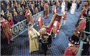  ?? Adrian Dennis Associated Press ?? A VOICE OF REASON FOR THE QUEEN A procession led by the queen and Philip, her most reliable political advisor, walks to the House of Lords before her speech during the ceremonial opening of Parliament on Nov. 13, 2002.