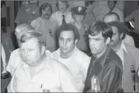  ?? The Associated Press ?? THE LOST TAPES: Serial killer David Berkowitz, known as “Son of Sam,” arrives at Brooklyn Courthouse in New York on Aug. 11, 1977. A new documentar­y on the Smithsonia­n Channel paints a portrait of the fearful, dysfunctio­nal New York City before...