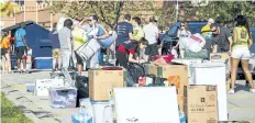  ?? POSTMEDIA FILE PHOTO ?? Some of a group of more than 800 volunteers, shown in this photo from last year, help move in more than 2,300 students within six hours at Brock University. Move-In Day is Sunday.