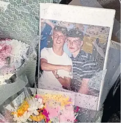  ??  ?? Flowers and pictures left in Arbroath in tribute to Adam.